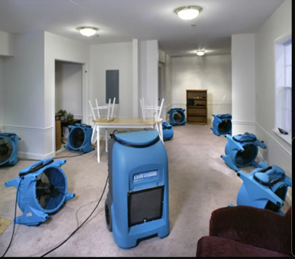 Air movers and dehumidifier setup for Water Damage Restoration in Rochester